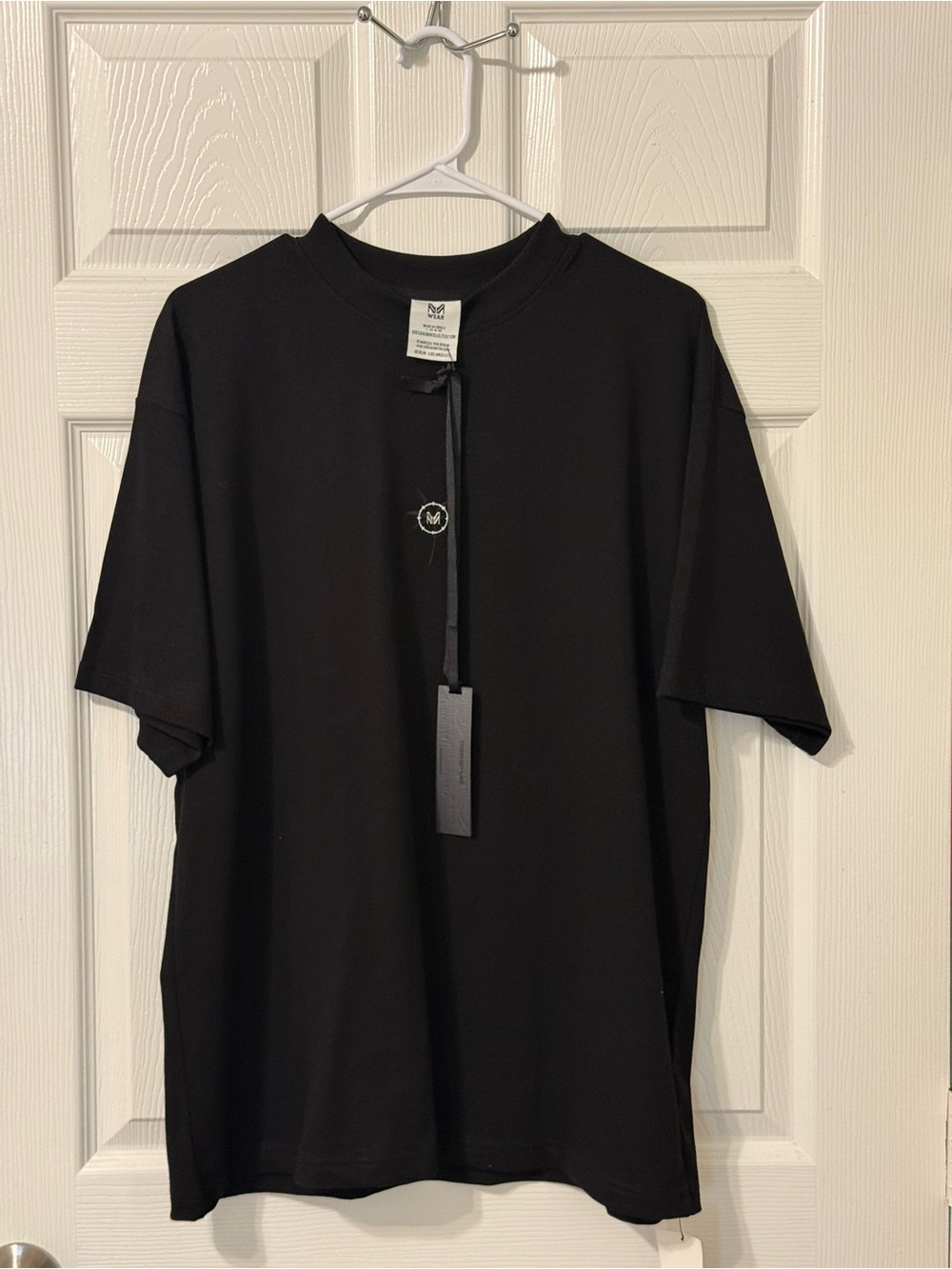Men's Black Crewneck Tee with Small Embroidered Emblem